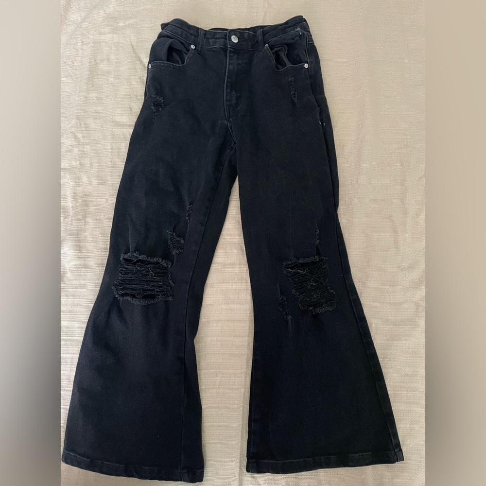Size 3 black flare out jeans from Almost Famous! Has some Damages.